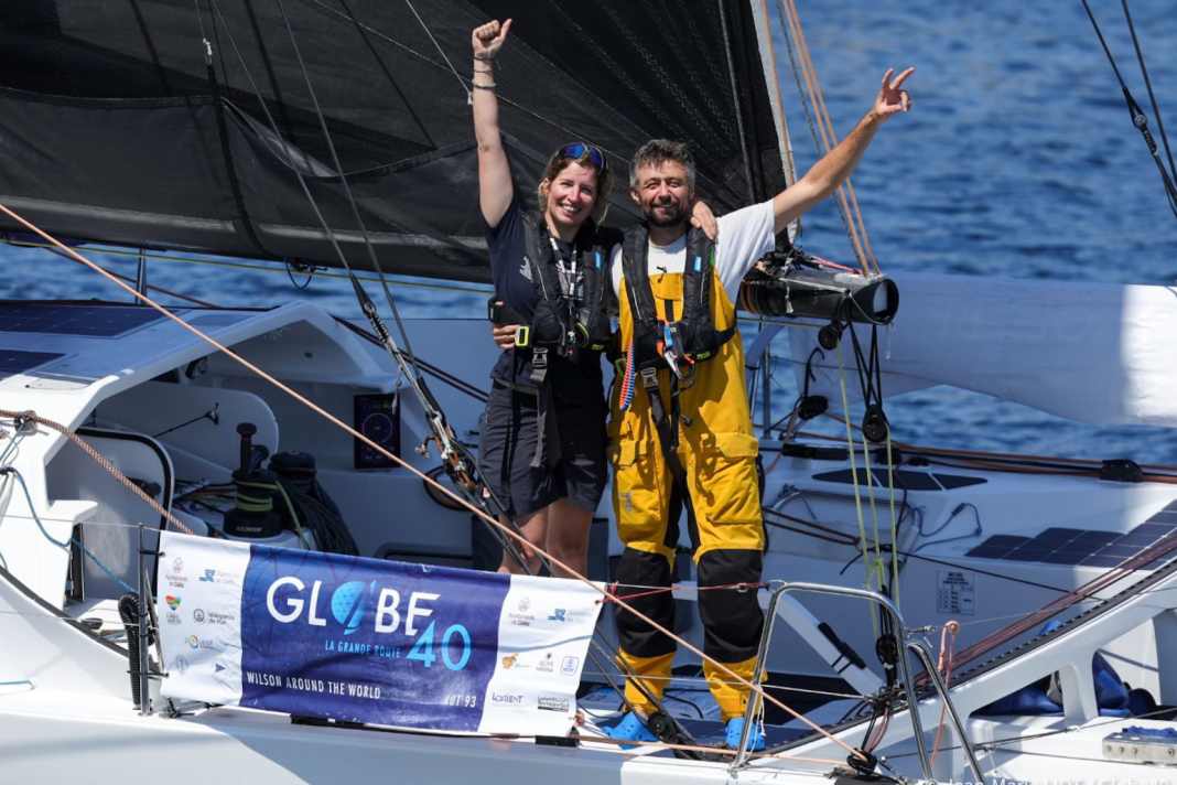 Lisa Berger and Jade Edwards-Leaney celebrate their fourth place at the finish.