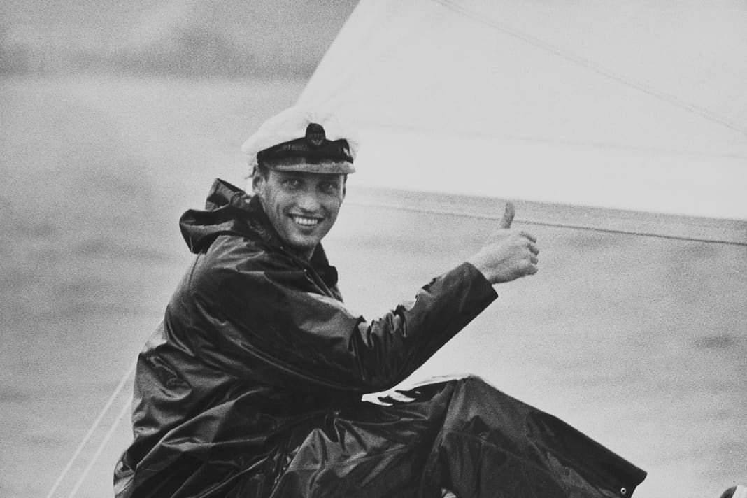 Crown Prince Harald happily on board. In oilskin with KNS cap, year unknown.
