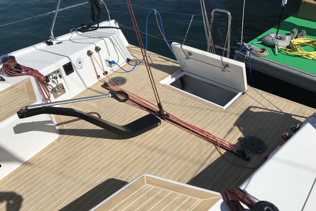 Division of labour. The tiller, which ends far forward, positions the rudder well away from the traveller and backstay