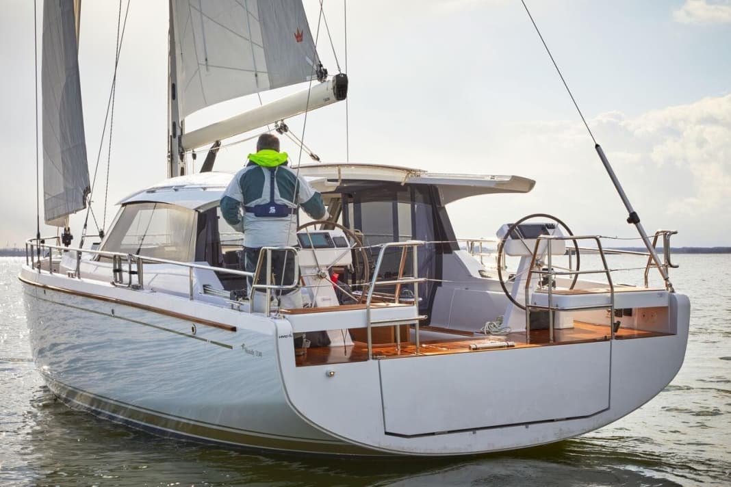 The wheels are positioned correctly for a good forward view; the helmsman looks over the roof or sideways past it