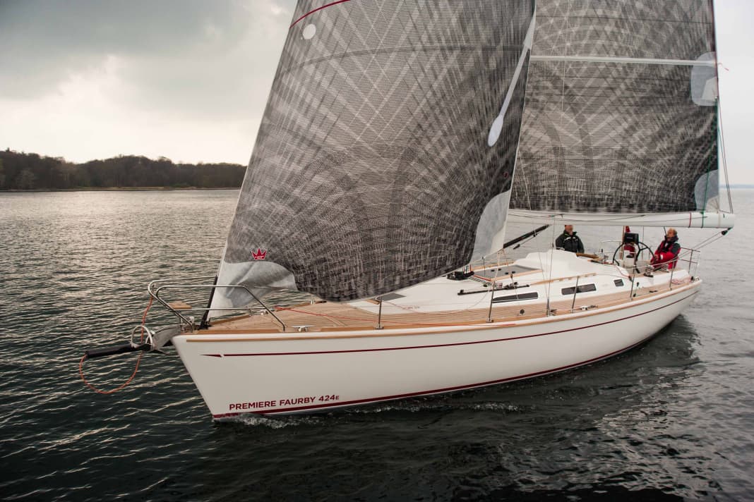 The shrouds of the new carbon fibre rig sit on the side of the boat and the headsail barely overlaps
