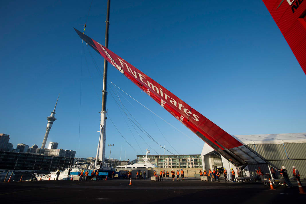The wing of the 72-foot catamaran is put in place