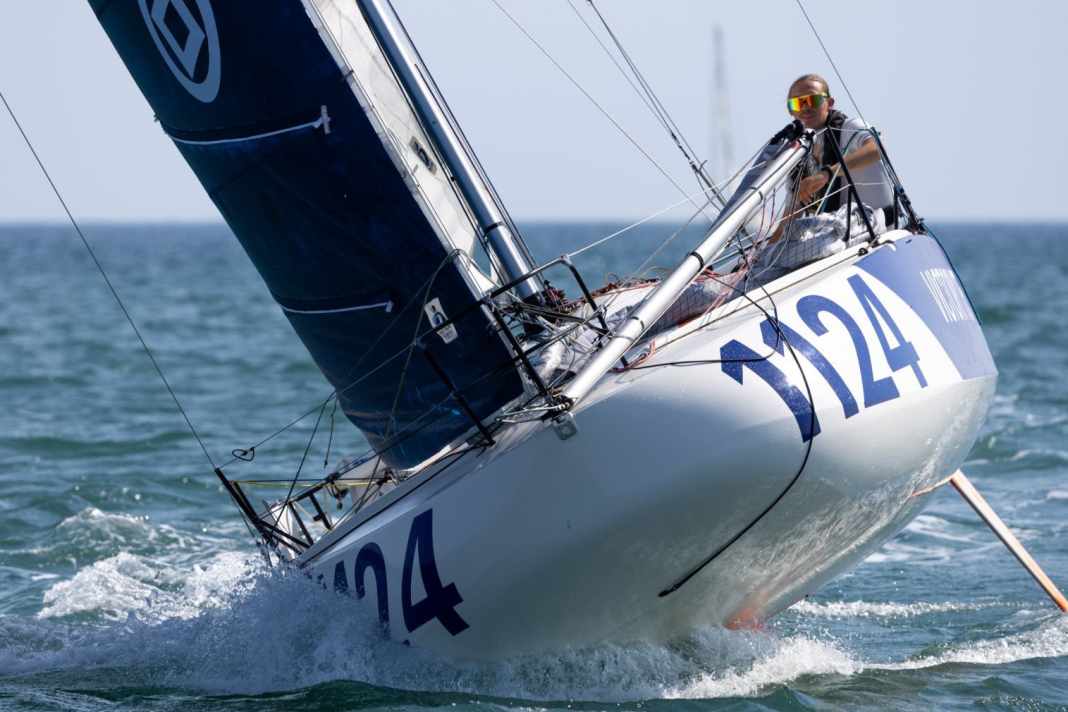 Tom Wehde races across the finish line of his first Mini Atlantique.