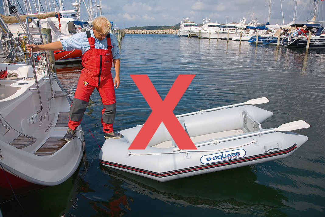 Wrong: the step over the bow ON the hose of the dinghy
