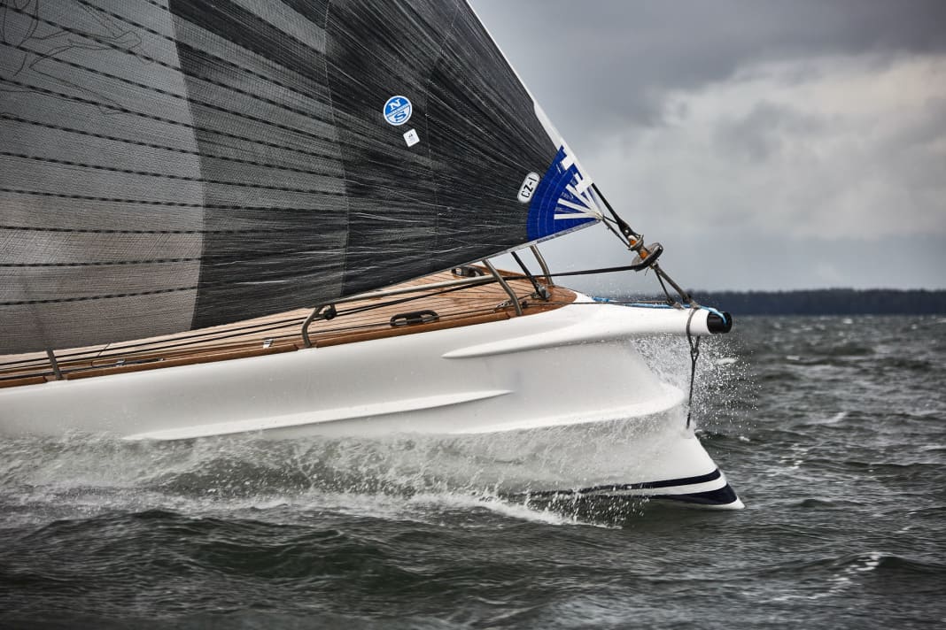 Open fire. At over 16 knots, the spray rails on the bow do a great job, most of the spray drifts to the side