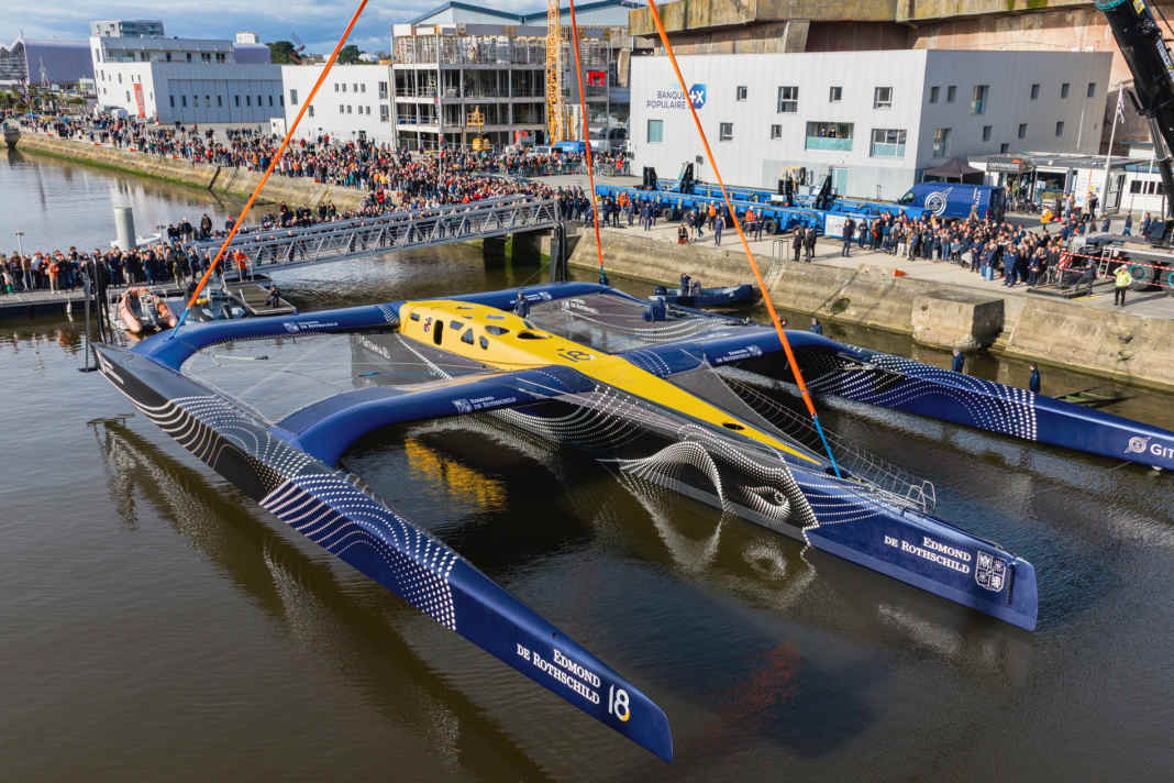 Here, the new "Gitana 18" enters the water for the first time in the harbour of La Base in Lorient.