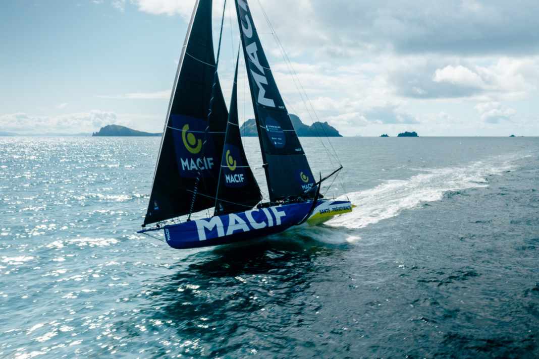 "Macif" leaves the Fastnet Rock behind.