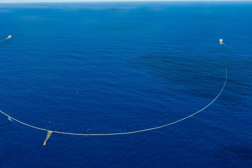 Two ships tow the net slowly