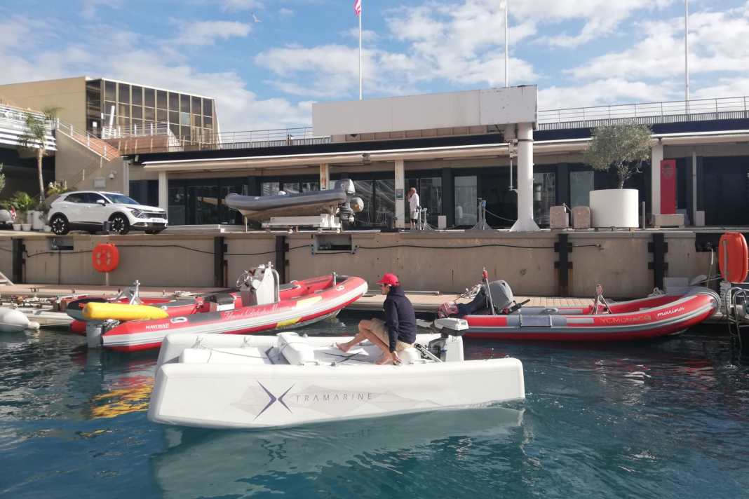 An unusual sight: the X-Fun as a dinghy in the marina.