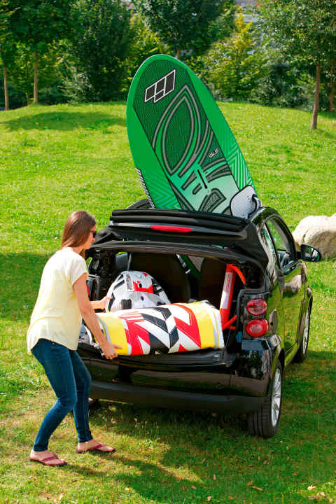   The inflatable windsurfing equipment fits in the luggage compartment...