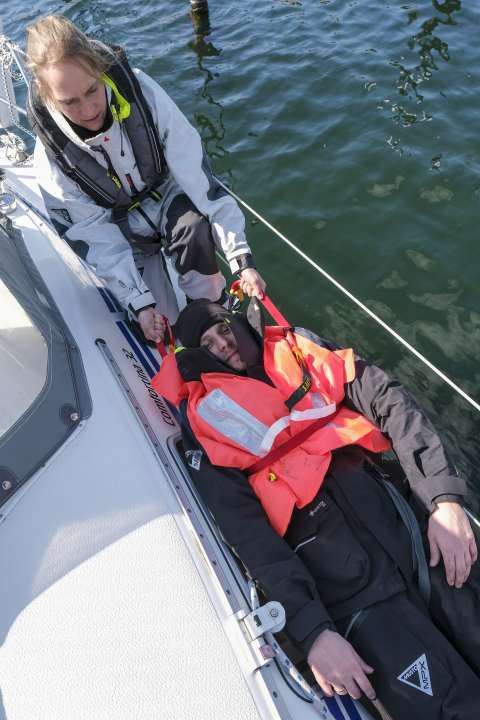 A harness can enable the person providing assistance to adopt a better posture.