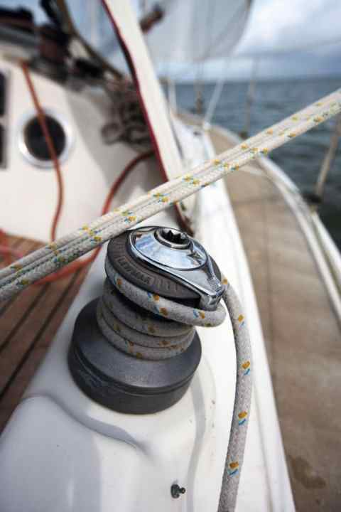   It's a little uncomfortable: the mainsheet and winch on the coaming get in each other's way. This is very annoying when cranking.