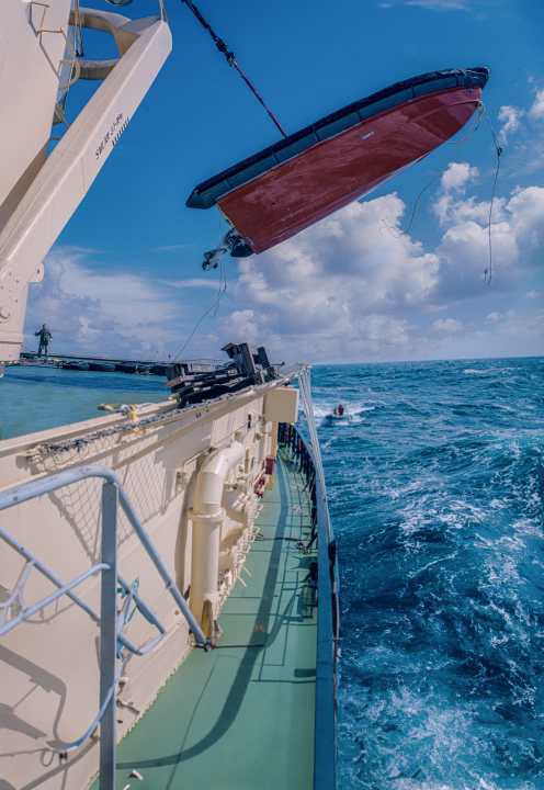 The escort boats had to be lowered into the water in metre-high waves - a delicate moment every time