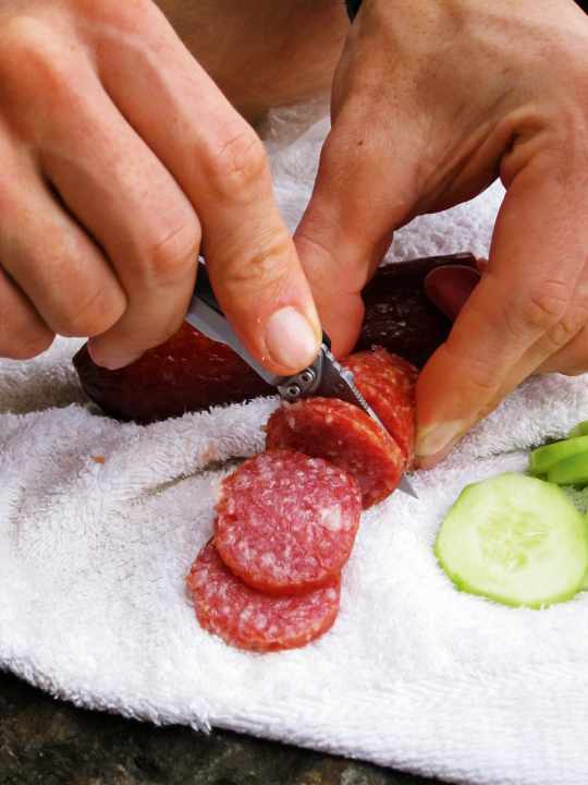 Better to ration your provisions: Cucumber and salami in thin slices, white bread and red wine. The right catering is the least of our problems.