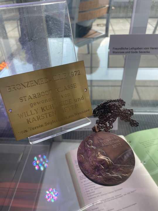 The bronze medal won by star boat helmsman Willy Kuhweide with Karsten Meyer in Kiel in 1972 is on display in Schilksee