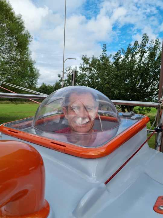   Everything in view? The solo sailor looks out of the "cabin" through the dome