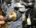 After the engine has warmed up, the oil filter and oil are changed on a four-stroke engine