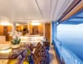Ethno look: The large saloon on the main deck presents the furnishing style of this exceptional concept. The wall of the superstructure, which can be opened upwards together with the glazing, has never before been repeated in a design of this format