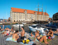 SUMMER TIMING on Strandgade. In the back, the North Atlantic House, one of the many converted historic warehouses | Photos Morten Strauch