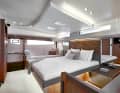 The owner's cabin extends across the entire width of the boat