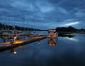 The cloud cover turns the summer night into Blue Hour. Calm over the harbour of Älmsta