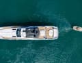 On the tug: tugs manoeuvre the yacht into position.