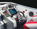 The steering position is clearly structured and has two lever racing controls, two rev counters and a trim indicator.