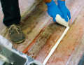 Once the remains of the old stringer system have been removed, the mixed adhesive can be applied using the "spray bag"