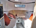 Bow seating area convertible into a berth