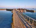 Snogebæk harbour - one of the smallest on Bornholm - is connected to the village and the sandy beach by a wooden pier