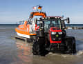 The wadeable tractor with its 280 hp six-cylinder engine can drive into the Baltic Sea water down to a depth of one metre