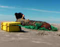 An explosives expert examining a torpedo in the Wadden Sea. The more the hull deteriorates, the more easily hazardous substances can leak out