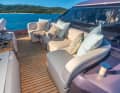 Upholstered seats and sun loungers in the bow.