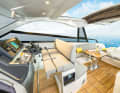 The standard helm bench for three people is new. The feet are mounted on a tubular frame.
