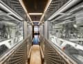 The massage room is followed by a corridor that leads through the glass engine room to the guest cabins.