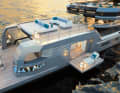At the stern, the beach club becomes a resort. The tender parks off to the side.