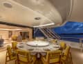When the base is fully raised, the aft deck can be used in a variety of ways. The upper deck terrace has a dining area. The owner's desk is also located in the saloon.