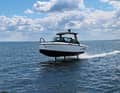 Silent and above the waves. The Candela C-8 flies over the water with its wings.