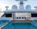 On the sun deck, the shipyard has created a large pool with a bar and sun loungers aft.