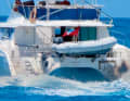 Black exhaust fumes from the diesel engine on the starboard side.