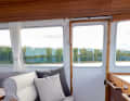 The backrest of the front passenger seat can be folded down, creating a seating area with a U-shaped sofa behind it.