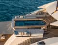 Pool deck: The five-metre pool lets light shine through the glass floor into …