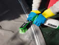 Step 3: Spray the special cleaner onto the damp cloth and work it into the fabric using a soft brush.
