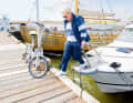 Going ashore: If the bike is too heavy, the 77-year-old asks for help.