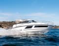The Grandezza 34 taking a sharp turn. The enormous freeboard and the high railing are clearly visible, conveying a great sense of safety.
