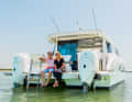 Between the two outboard engines is the swimming platform, which features a stainless-steel swim ladder.