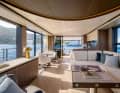 In the large saloon, there is a galley as well as a seating area with a U-shaped sofa and two armchairs.