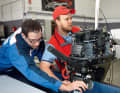 Before going out on the water for the test runs, each engine is attached, secured and tuned.