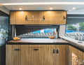 Enjoy your meal: the small galley serves up to six overnight guests.