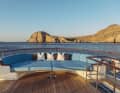 The semi-circular aft seating area converts into a sun lounger.